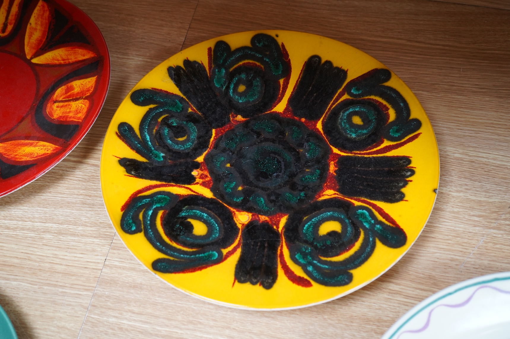 Two mid century Poole pottery Delphis chargers, 36cm in diameter